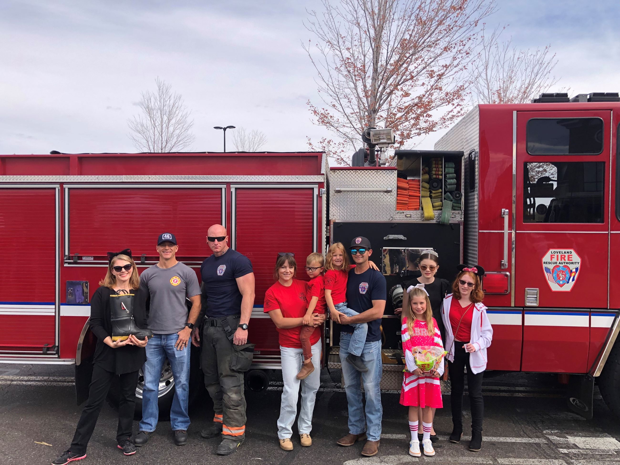 Photo of group of LFRA staff in front of fire engine in a parking lot