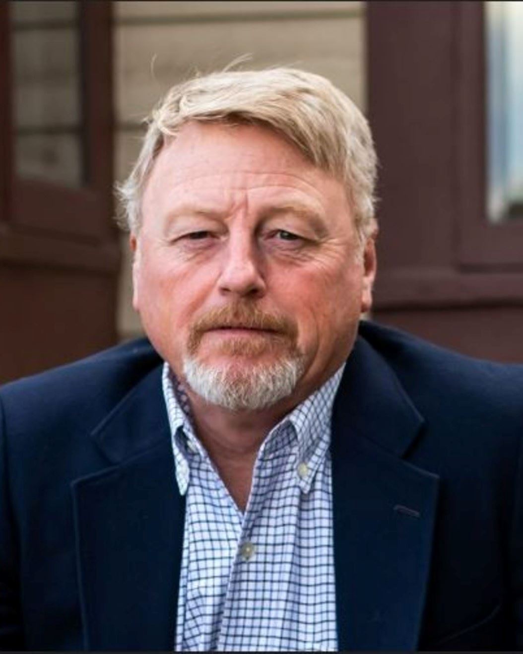 Photo a Bill Lundquist in a suit coat 